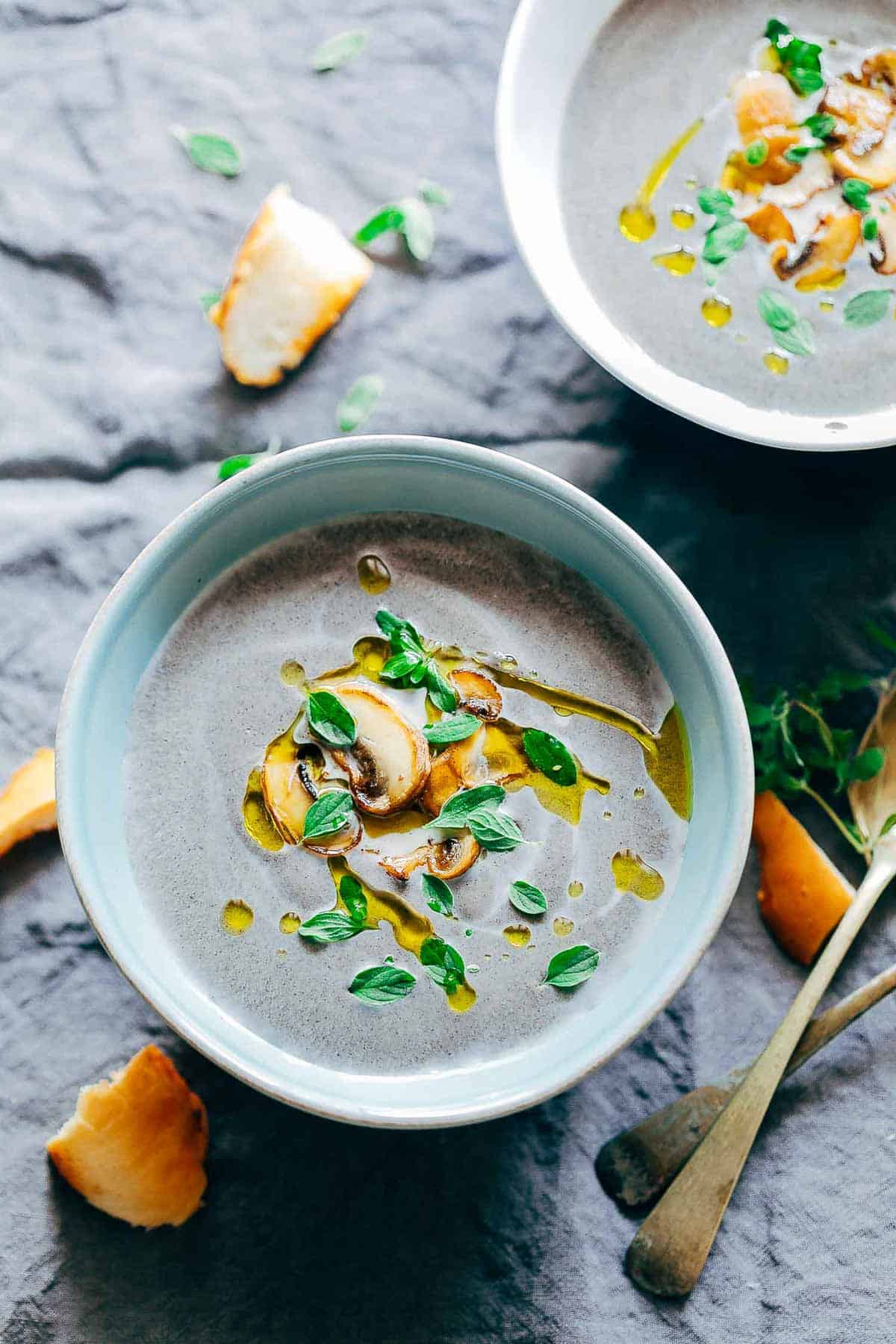A picture of the Healthy Creamy Mushroom Soup served in a blue bowl.