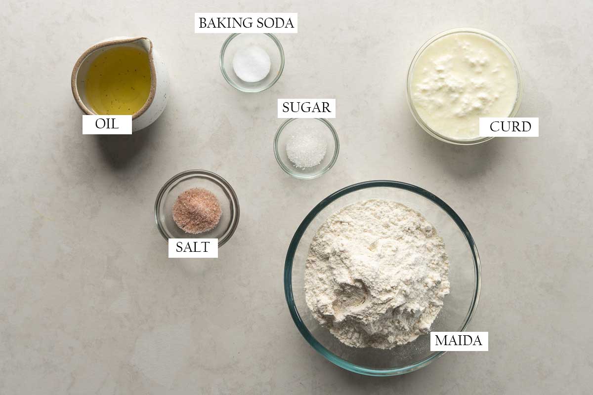 All the ingredients for the dough pictured together with text to identify them