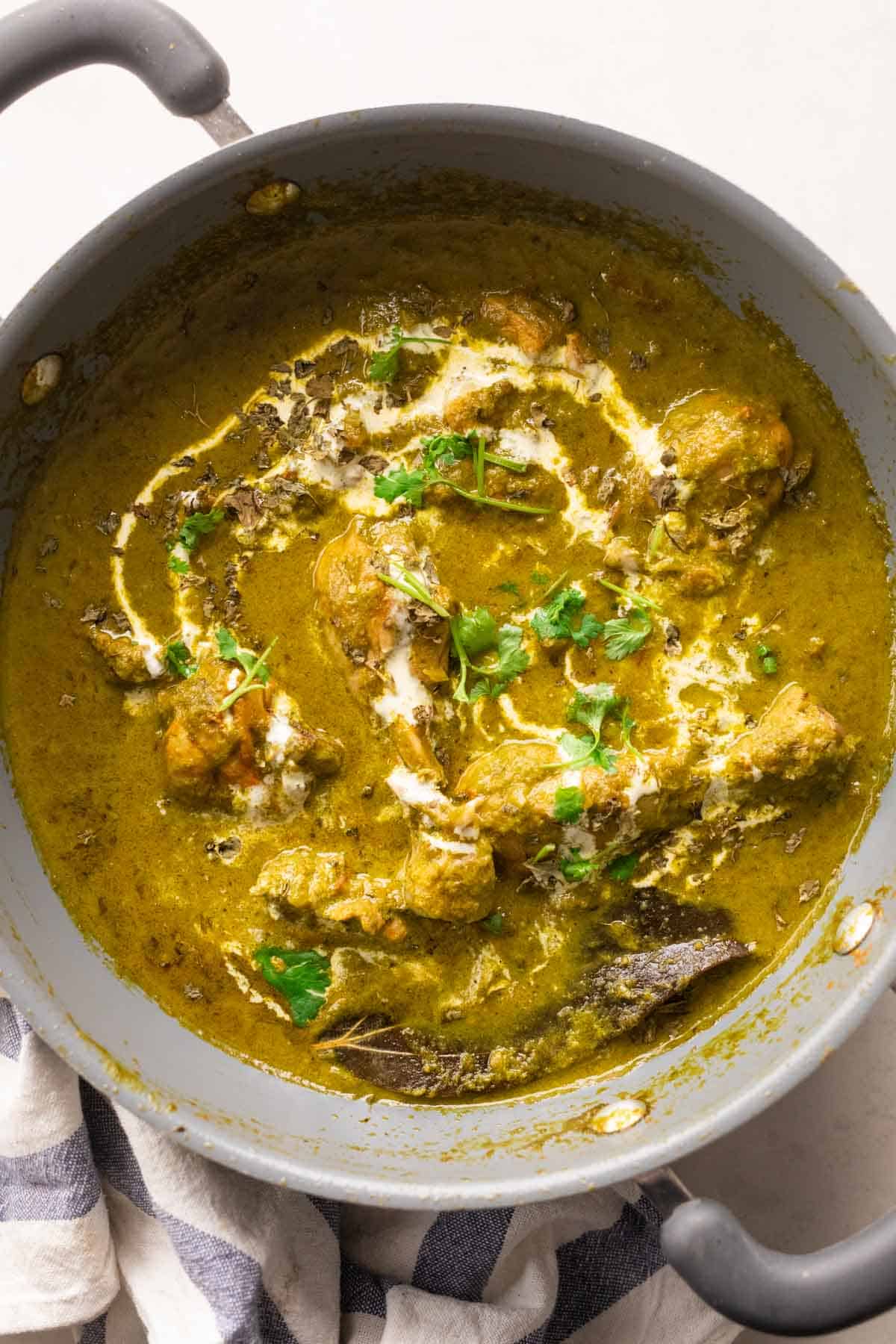 Picture of saag chicken served in the pan that it was cooked in