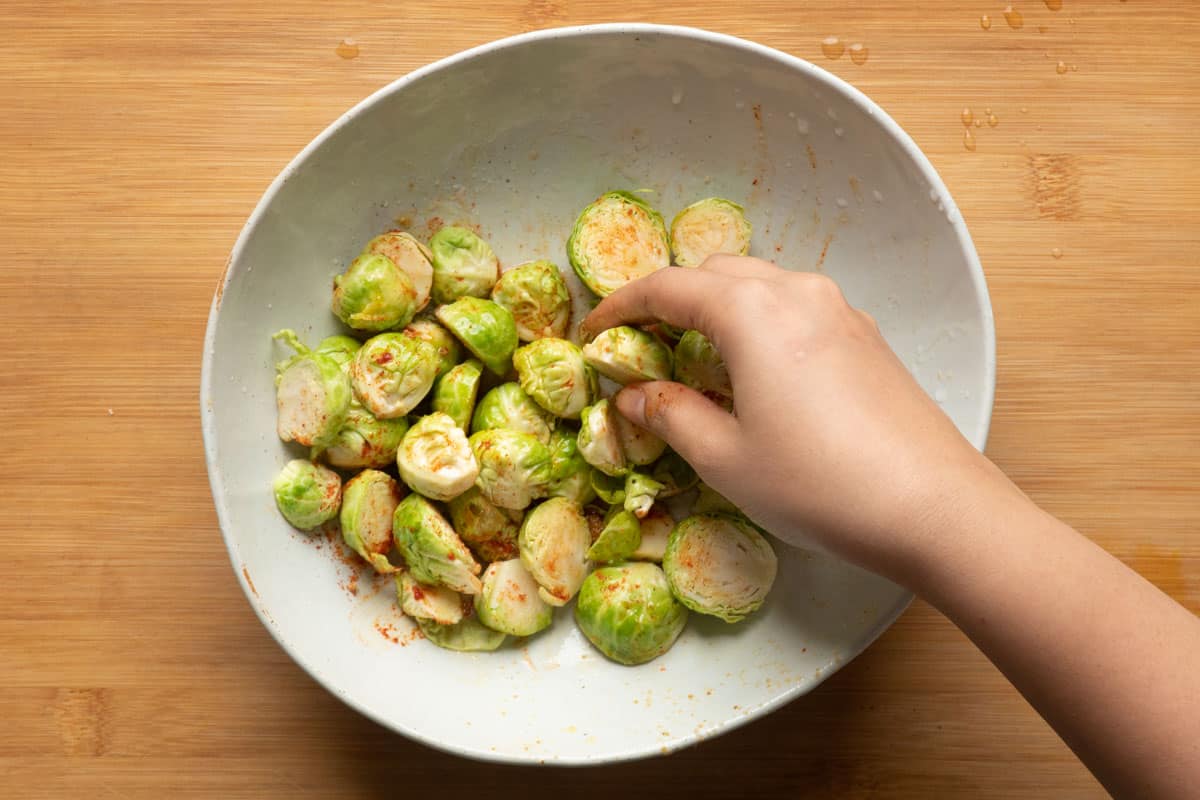 Picture of brussel sprouts tossed in seasoning