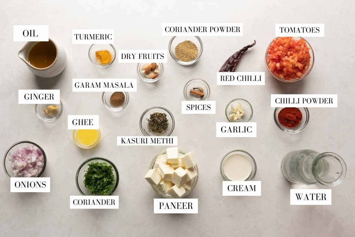 Picture of all the ingredients for paneer lababdar with text to identify them
