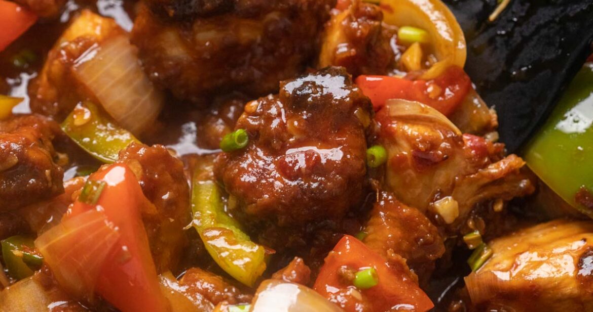 Close up of szechuan chicken in the wok