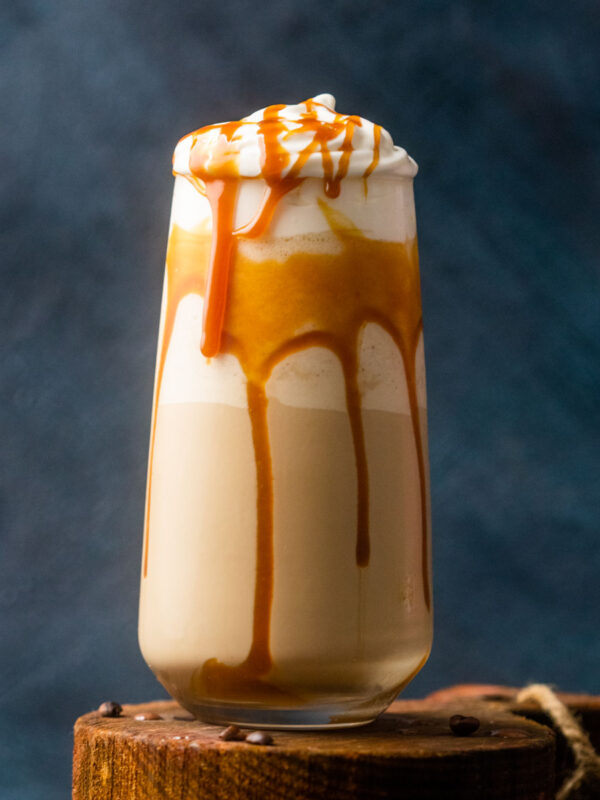 Caramel cold coffee served in a tall glass