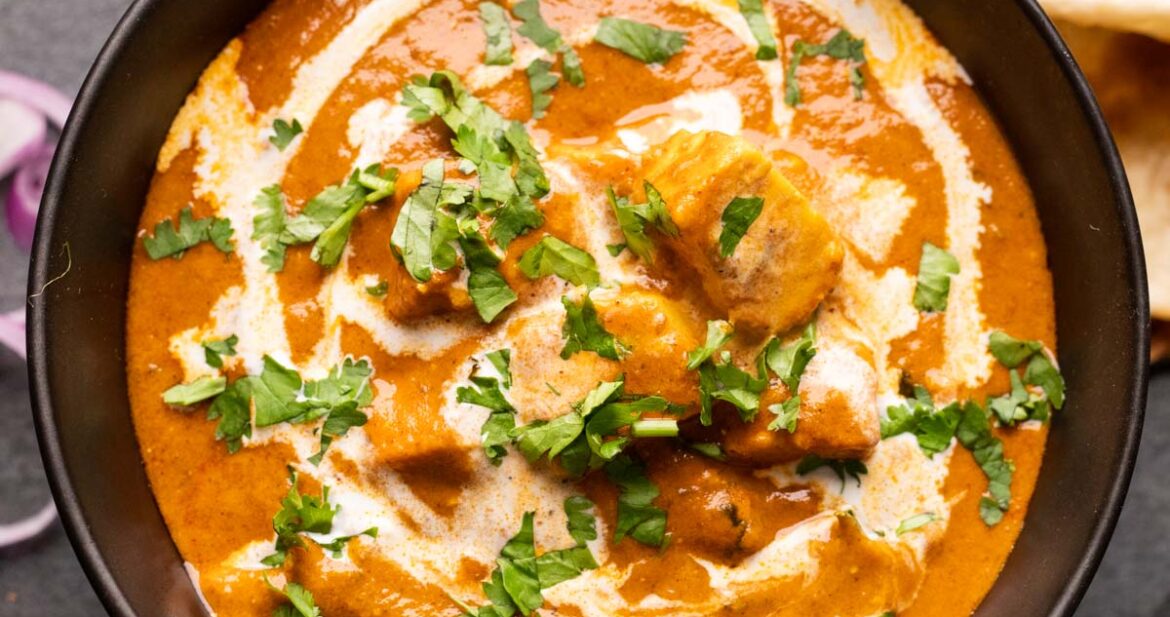 Picture of shahi paneer served in a black bowl