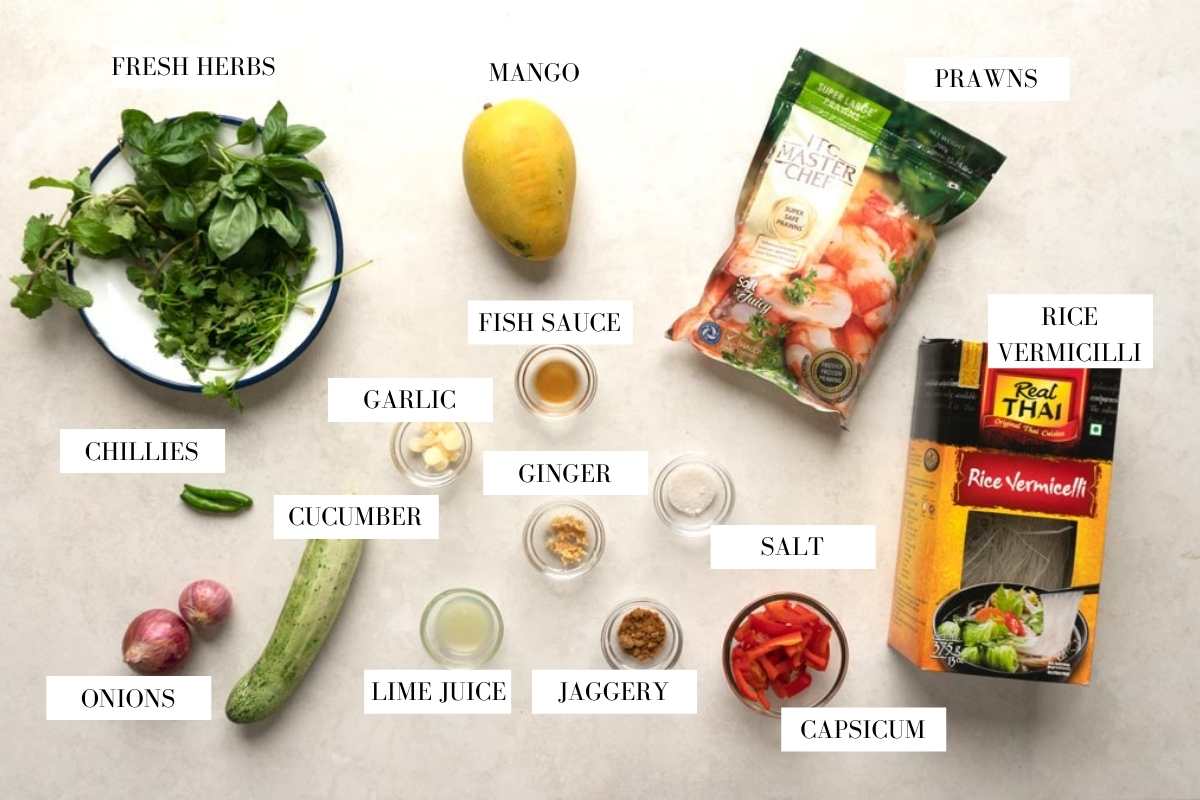 Picture of all the ingredients required for Thai Prawn Mango Salad with text overlay