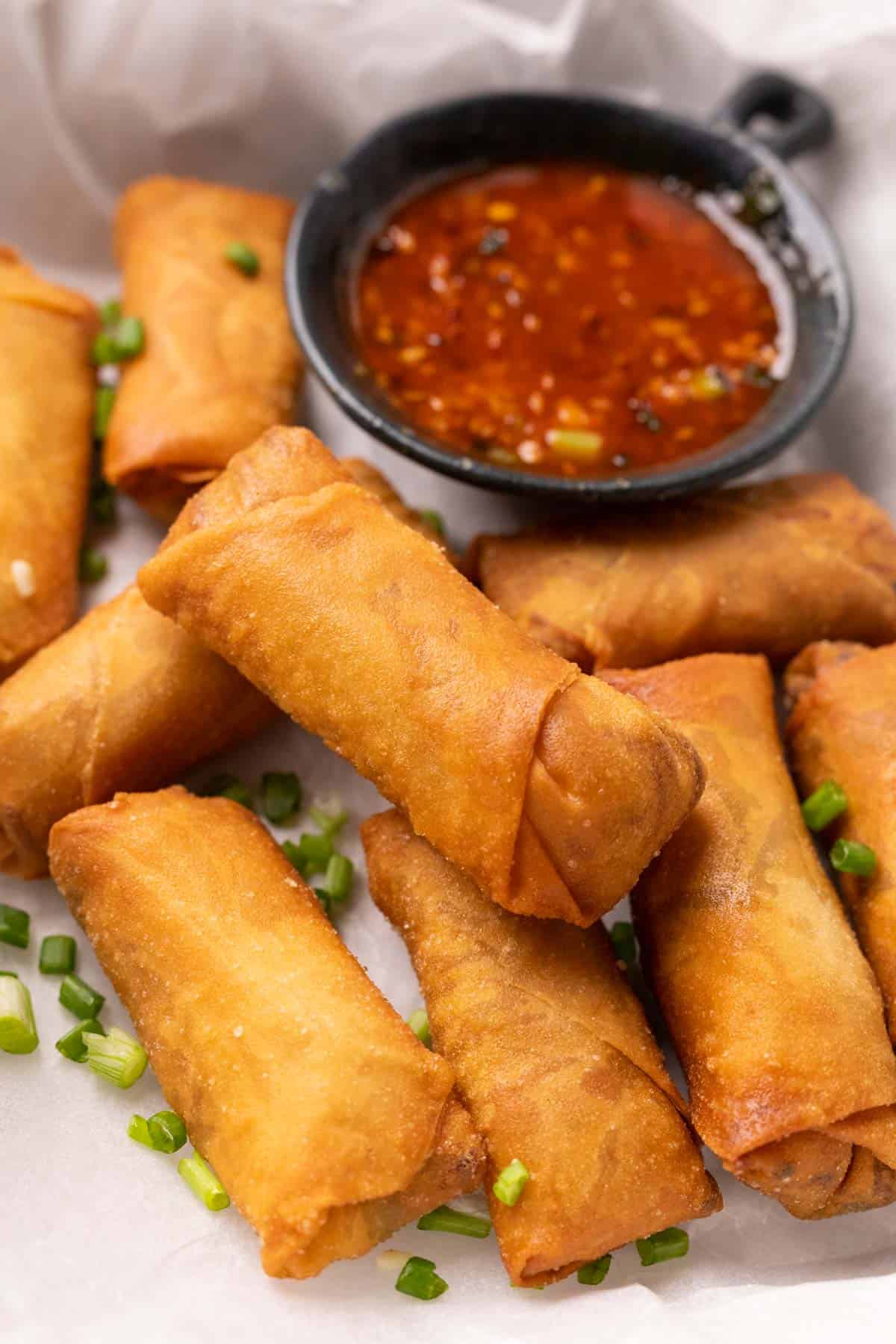 Spring Rolls served on a platter with sweet chilli sauce