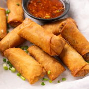 Spring Rolls served on a platter with sweet chilli sauce
