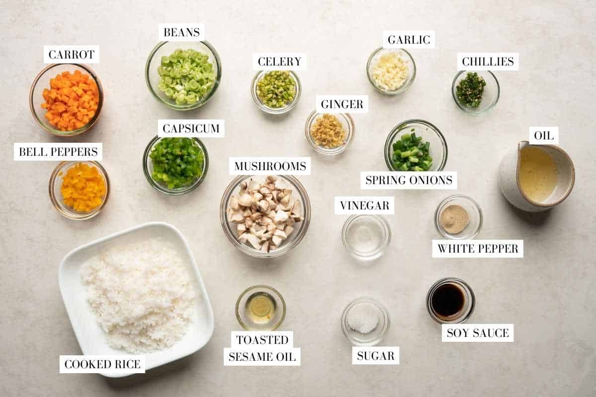 Picture of all the ingredients for fried rice with text to identify them