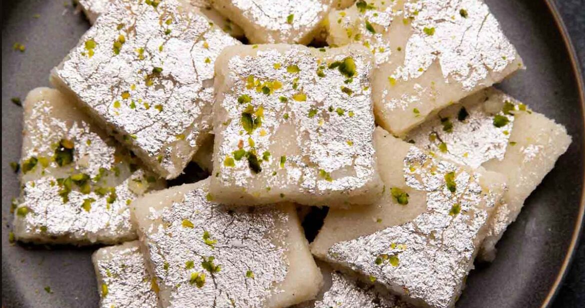 Coconut barfi served on a grey plate
