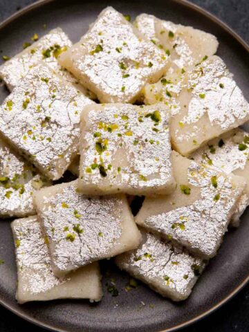 Coconut barfi served on a grey plate