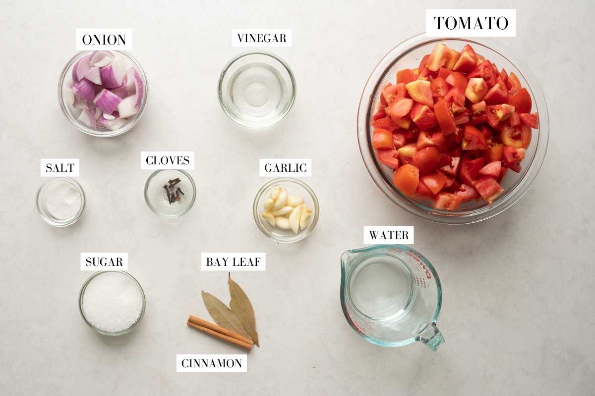 Picture of all the ingredients for tomato ketchup with text to identify them