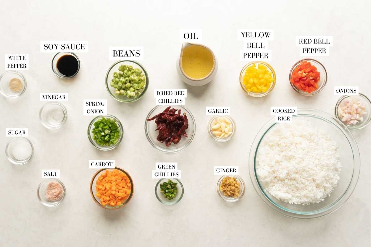 Picture of all the ingredients for chilli garlic fried rice with text to identify them