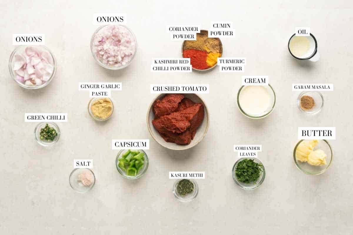 Picture of all the ingredients required for slow cooker yellow tikka masala with text to identify them