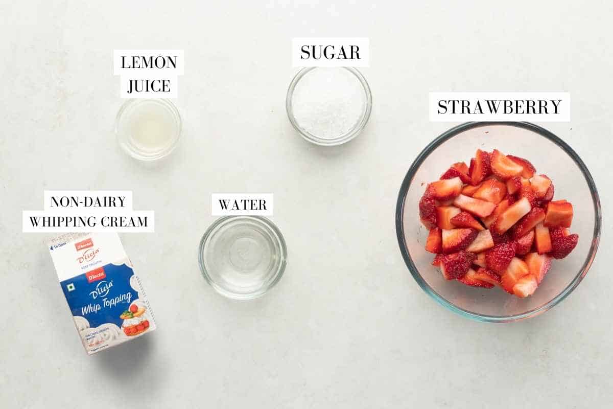 Picture of all the ingredients required for strawberry mousse with text to identify them