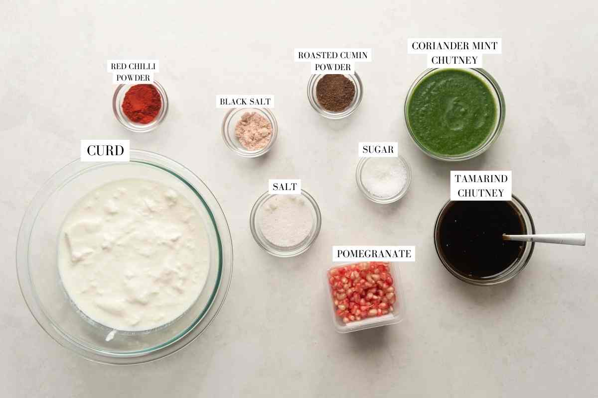 Picture of all the ingredients required for Dahi Vada with text to identify them