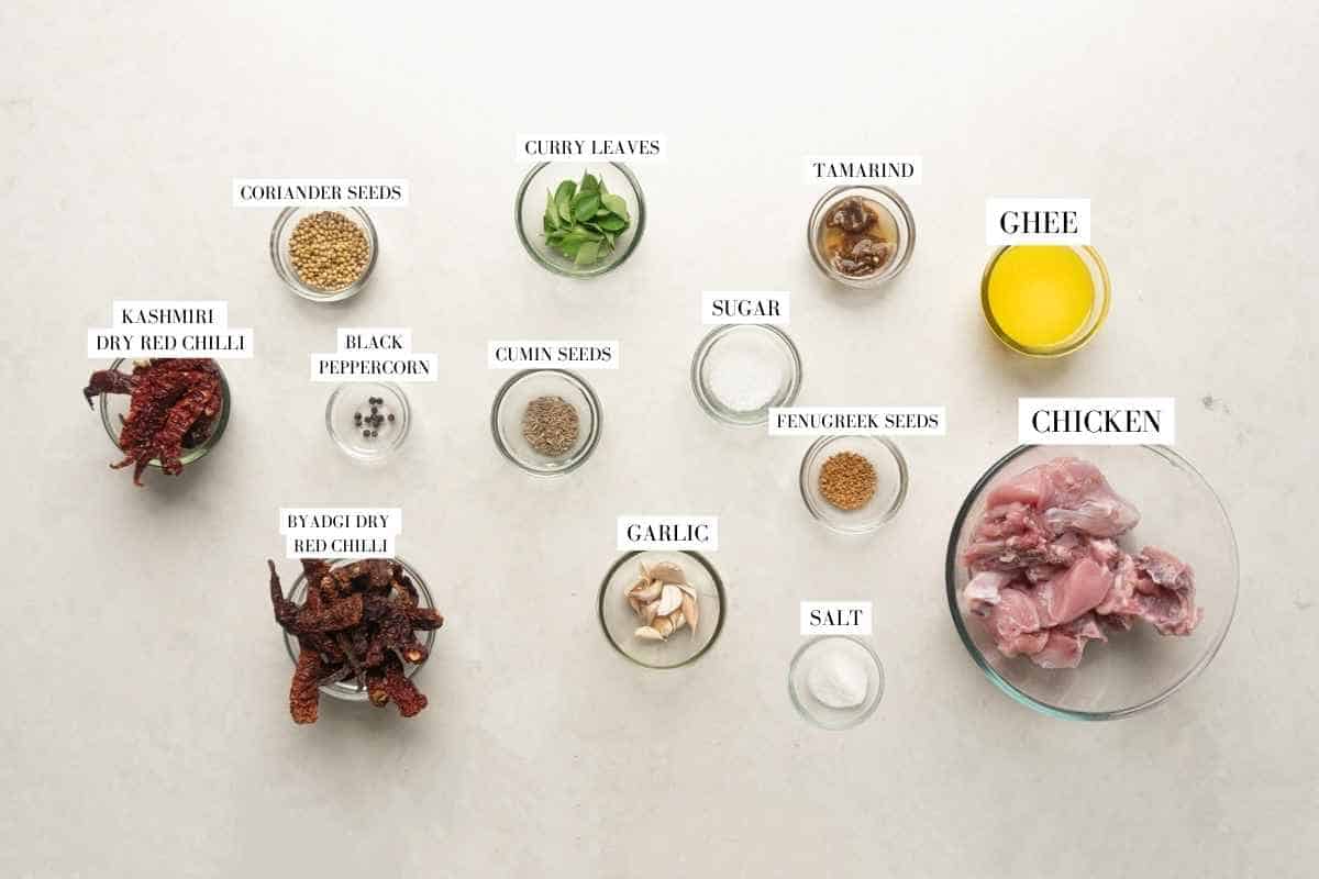 Picture of all the ingredients required for Chicken Ghee Roast with text to identify them