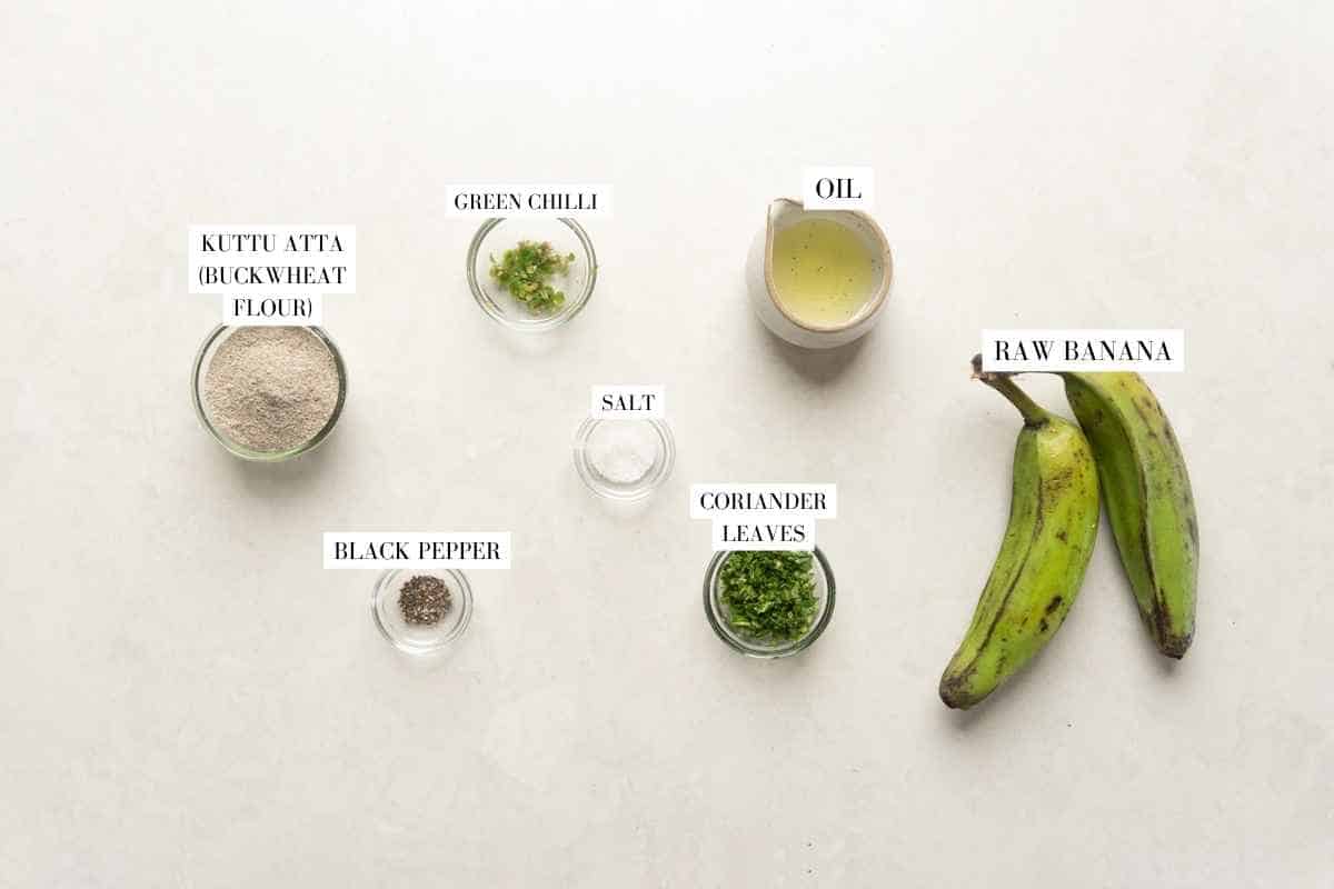 Picture of all the ingredients for raw banana tikki with text to identify them