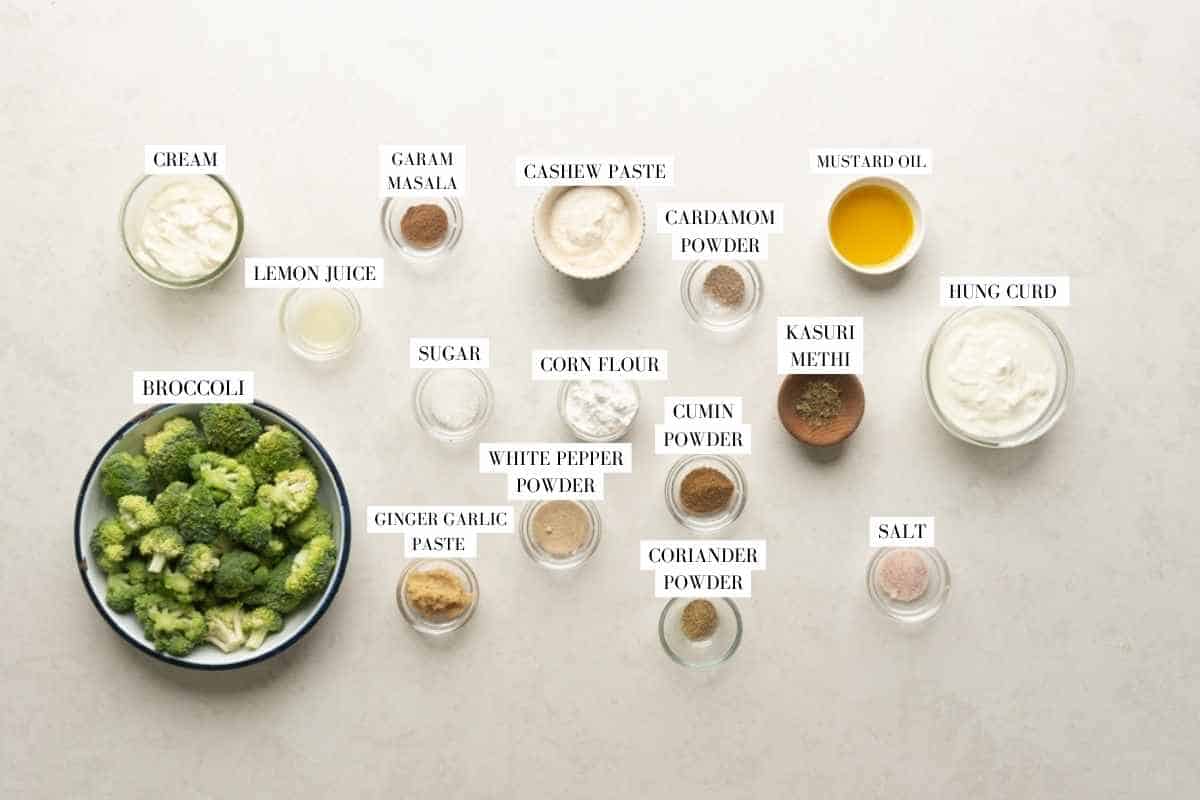 Picture of all the ingredients for malai-broccoli with text to identify them