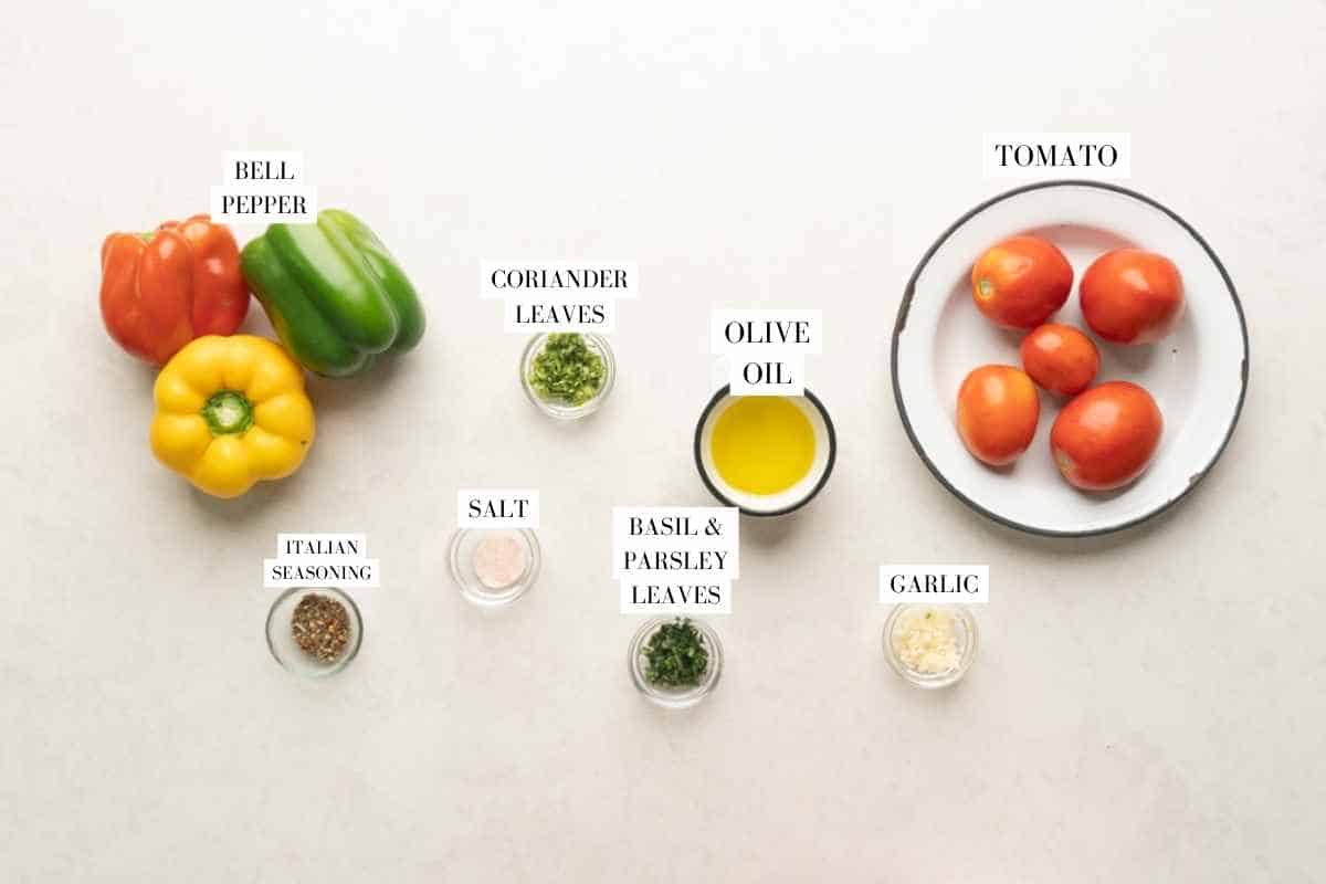 Picture of all the ingredients for roasted tomato salsa with text to identify them