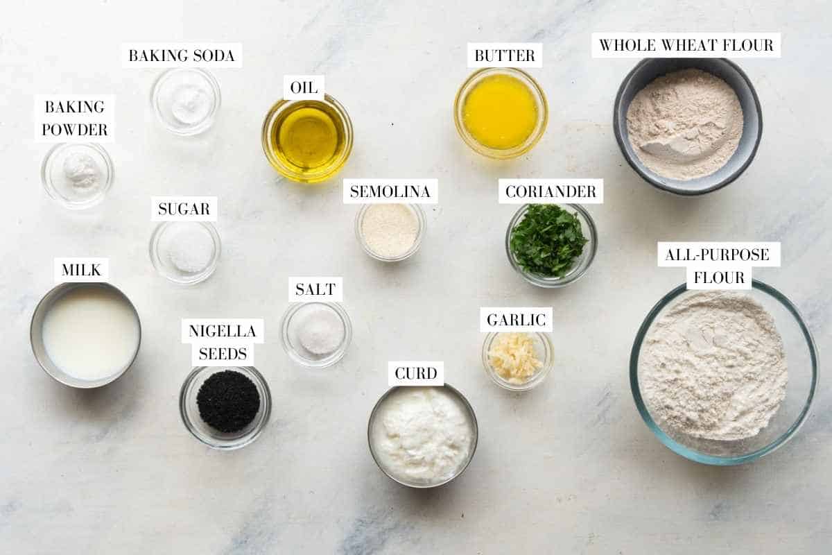 Picture of all the ingredients for Garlic Naan with text to identify them