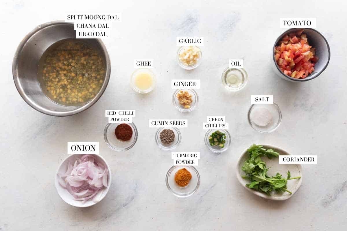 Picture of all the ingredients for mixed dhaba dal with text to identify them