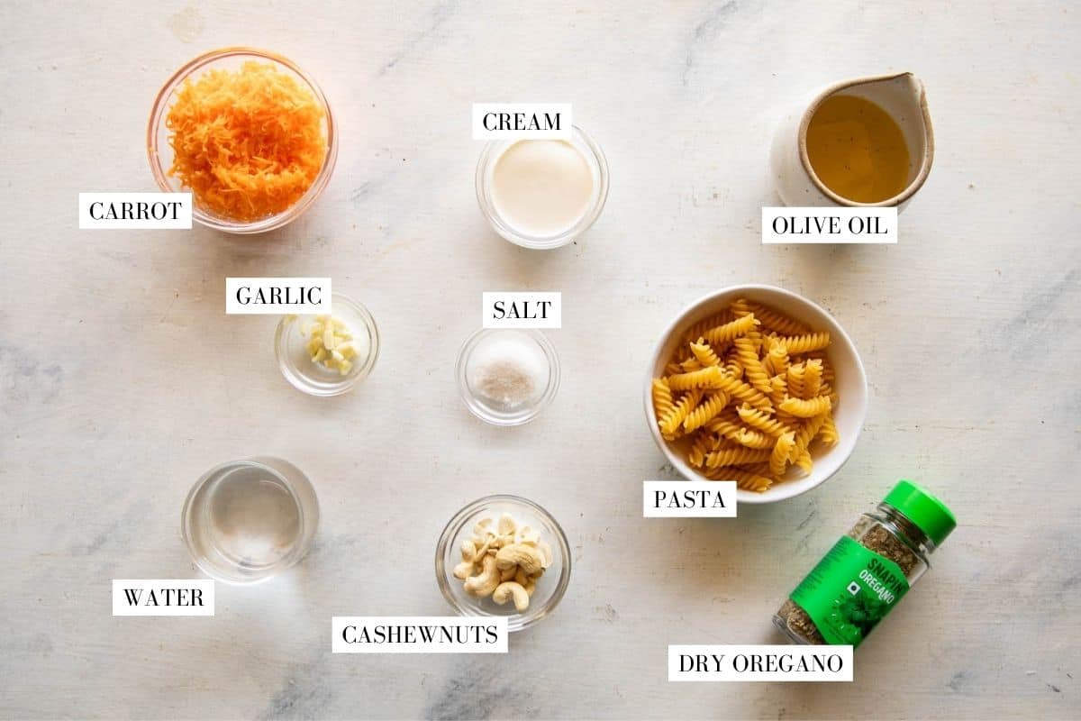 Picture of all the ingredients for carrot pasta sauce with text to identify them
