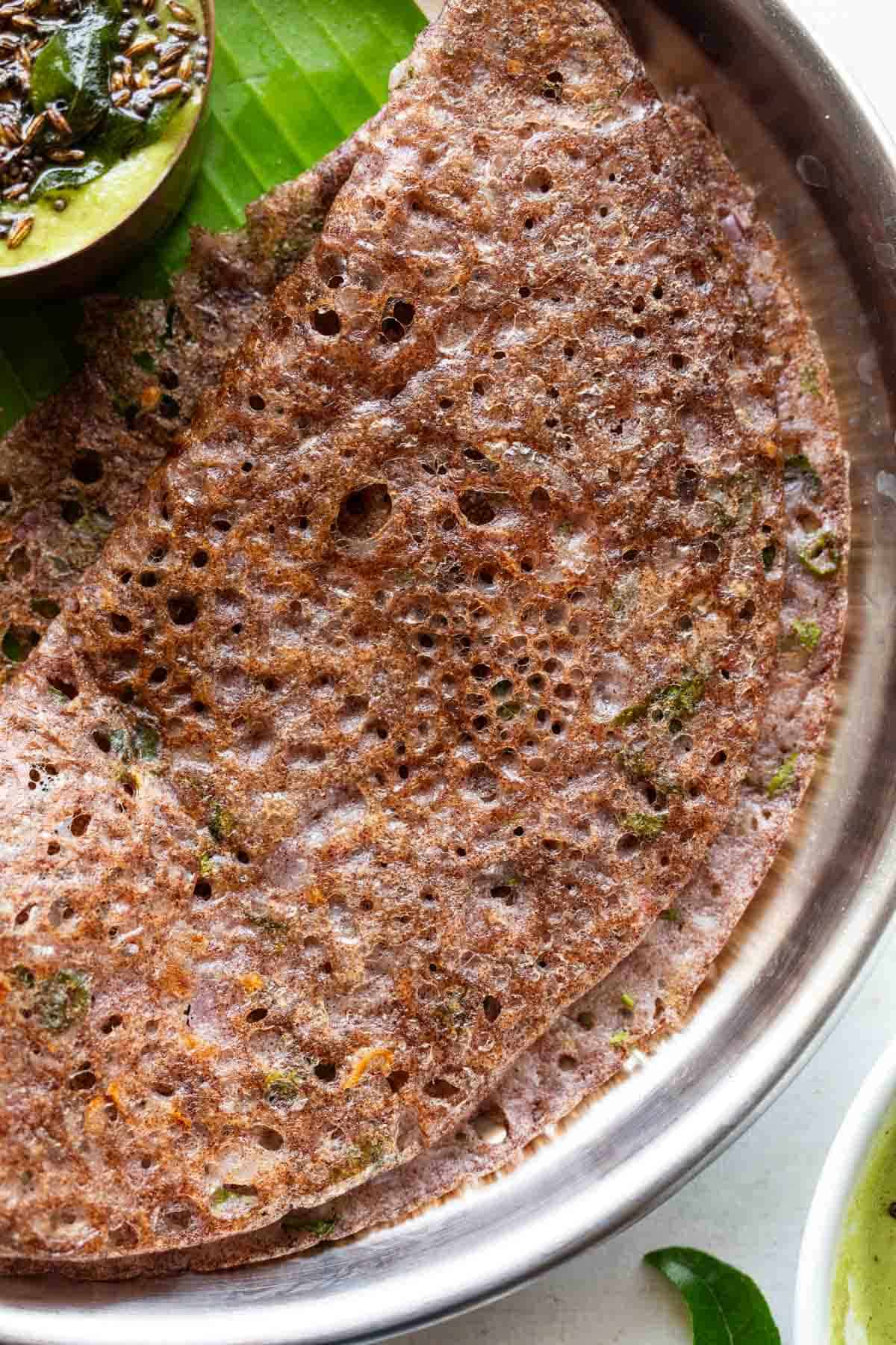 Close up of ragi dosa to show the lacy, crispy texture