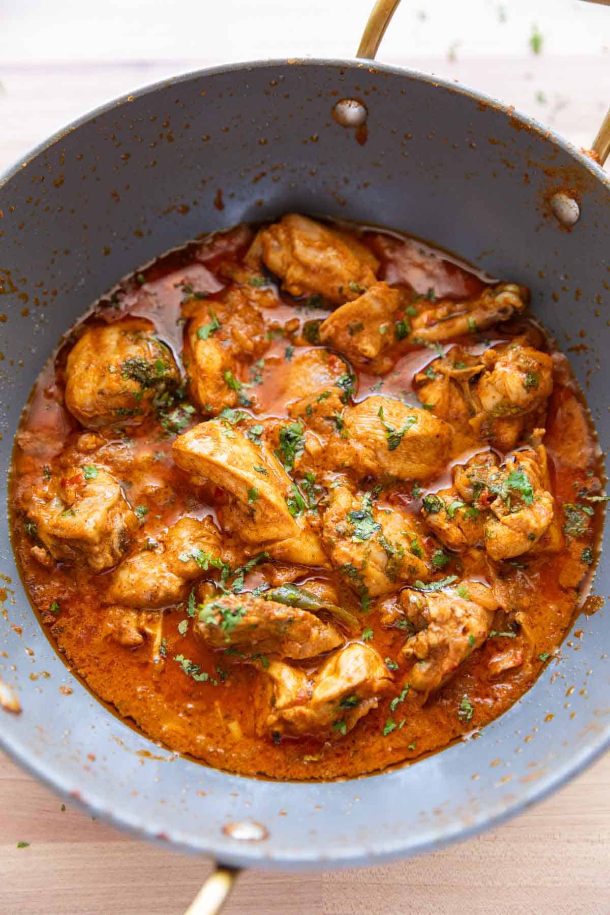 Dahi chicken pictured in the kadhai its cooked in