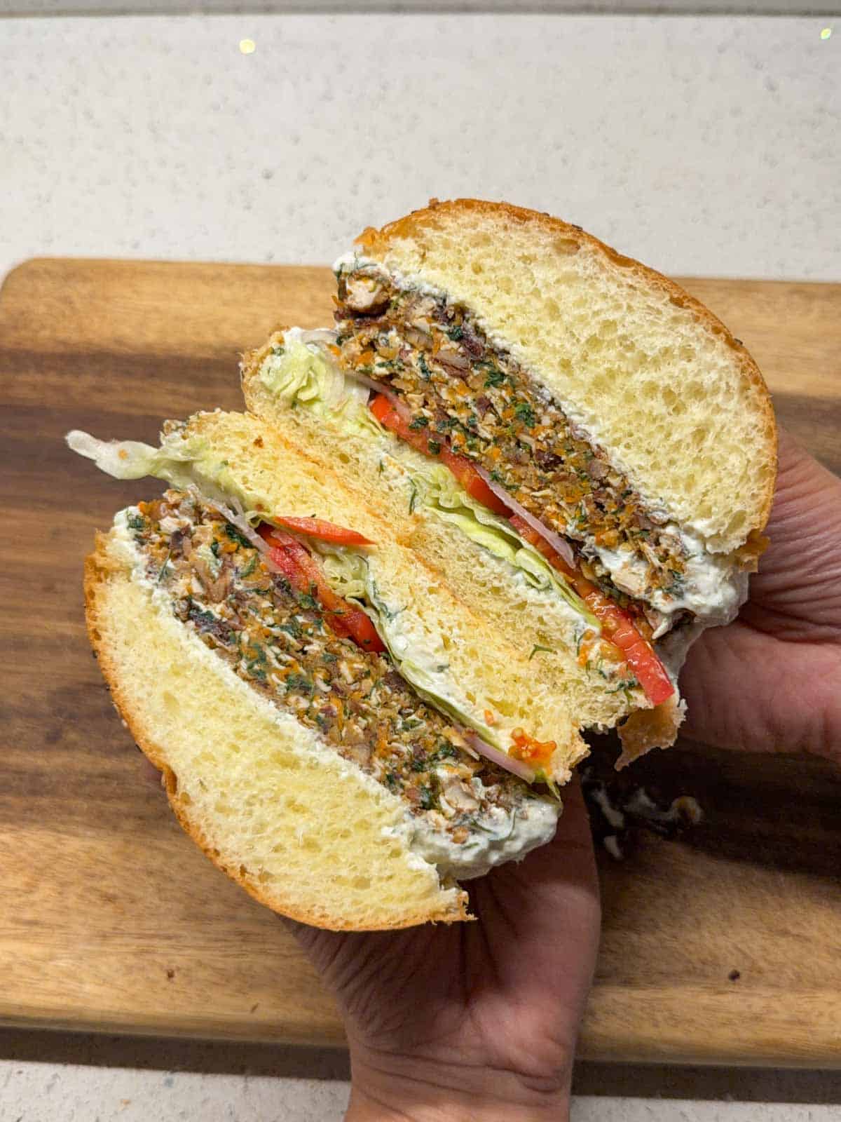 crispy veggie burger cut in half to showcase it's texture