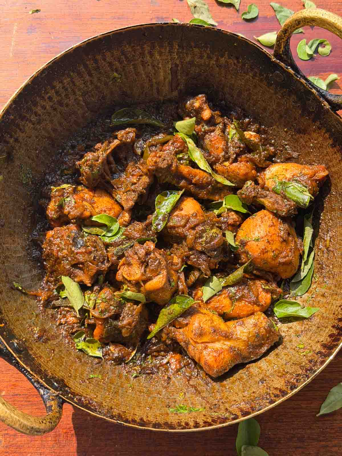 an image of curry leaf chicken in the cooking vessel
