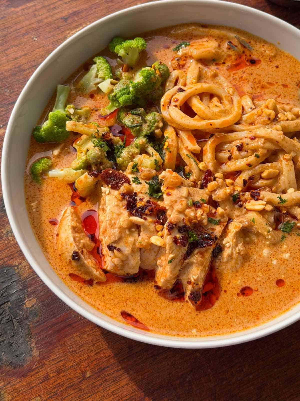a close up image of peanut butter ramen noodles to showcase it's color and texture
