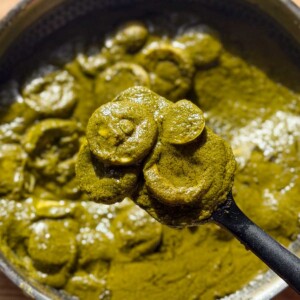 green egg curry in it's cooking vessel ready for serving