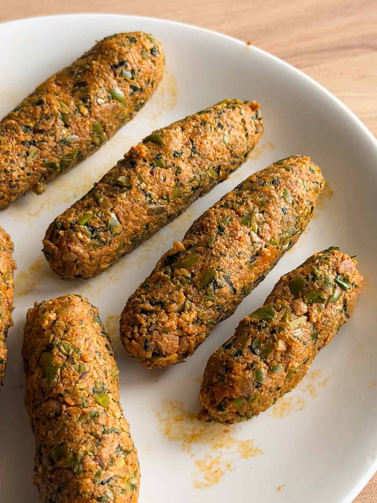 shaped veg seekh kebabs ready to be fried