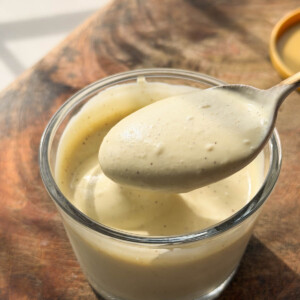 smooth and creamy veg mayo scooped up in a spoon