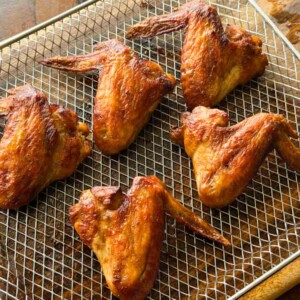 soy chicken wings in the air fryer tray ready to be served