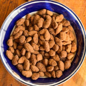 chocolate covered almonds in a bowl