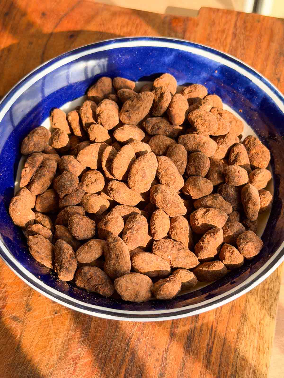 chocolate covered almonds in a bowl