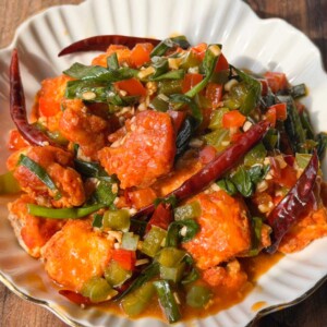 crispy chili tofu served in a white bowl