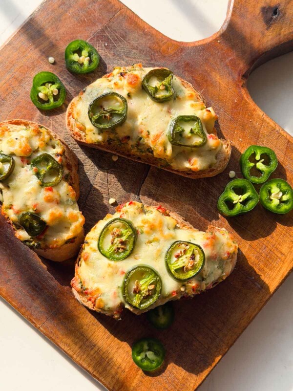 an image of jalapeno popper toasties served on a wooden board