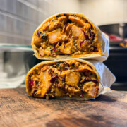 an assembled chicken tikka wrap ready to be eaten