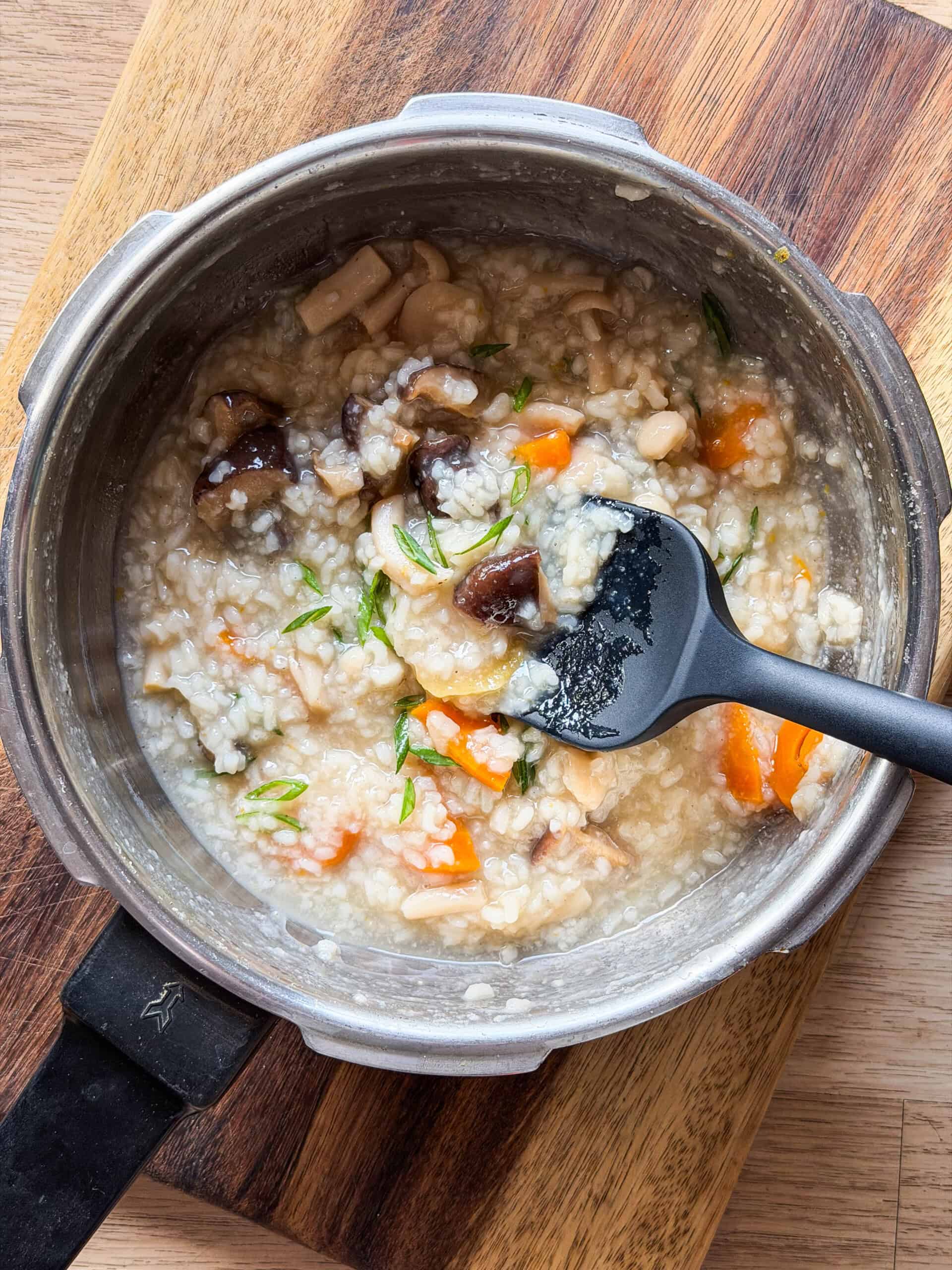 freshly made rice congee still in the pressure cooker it was cooked in