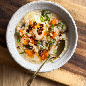 rice congee served in a bowl with toppings