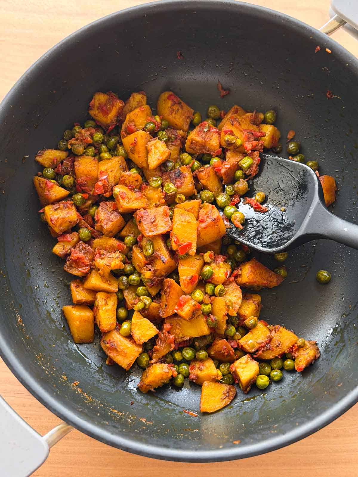 masala aloo matar still in its cooking vessel