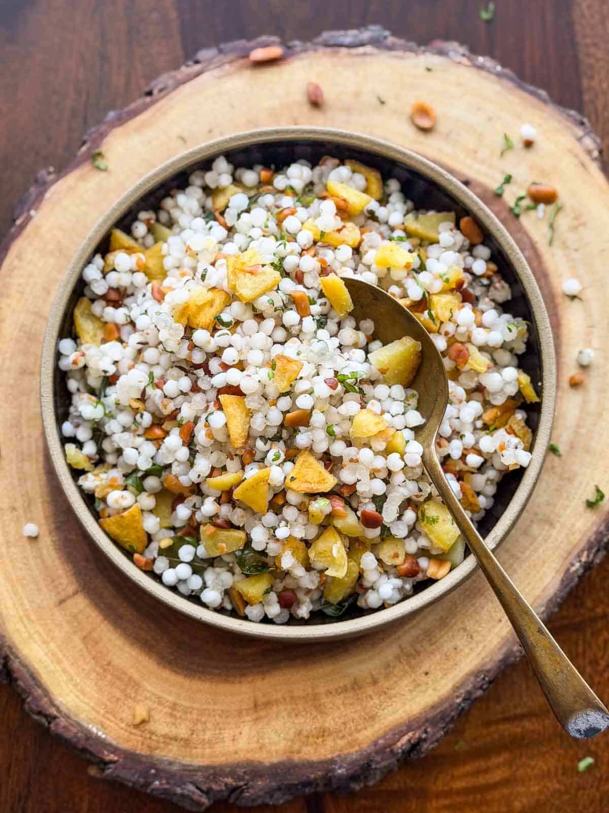 sabudana khichdi served in a bowl with spoon