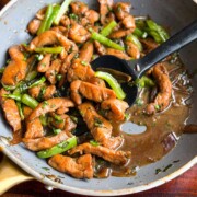 soy sauce chicken in the frying pan with ladle